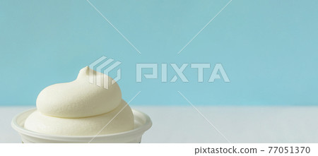 A cup of ice cream. Soft cream A cup of ice cream. Soft cream 77051370