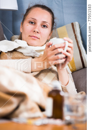 Woman being ill 77051583