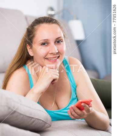 Woman using phone Woman using phone 77051626