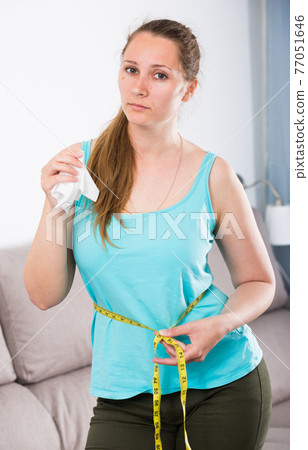 Woman sad to gain weight Woman sad to gain weight 77051646