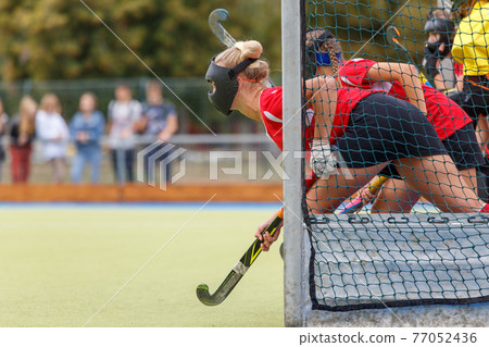 Field hockey player waiting for the penalty shot Field hockey player waiting for the penalty shot 77052436