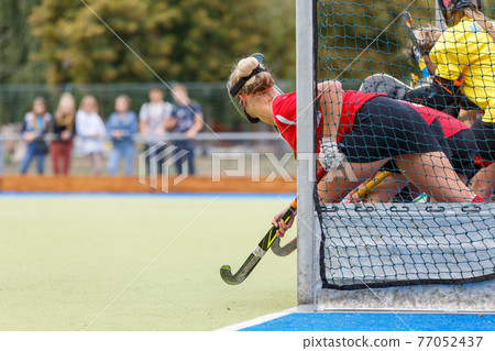 Field hockey player waiting for the penalty shot Field hockey player waiting for the penalty shot 77052437