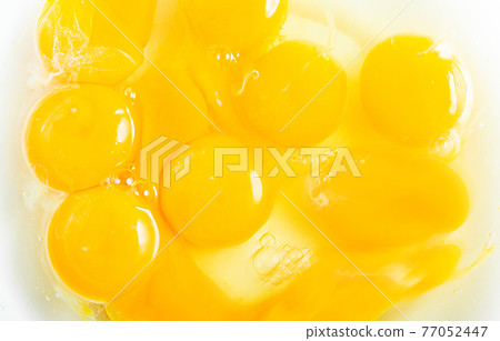 Beaten egg Raw egg in the middle of stirring 77052447