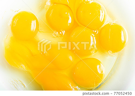 Beaten egg Raw egg in the middle of stirring 77052450