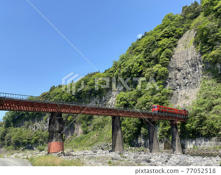 Iwato scenery Hyakueda iron bridge and red train Iwato scenery Hyakueda iron bridge and red train 77052518