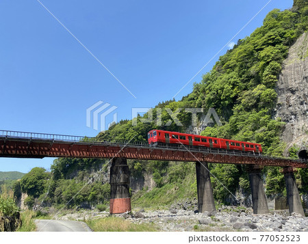 Iwato scenery Hyakueda iron bridge and red train Iwato scenery Hyakueda iron bridge and red train 77052523