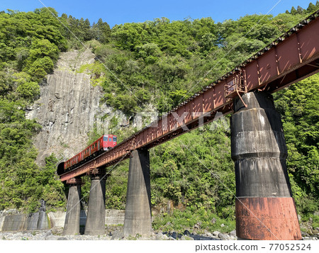 Iwato scenery Hyakueda iron bridge and red train Iwato scenery Hyakueda iron bridge and red train 77052524