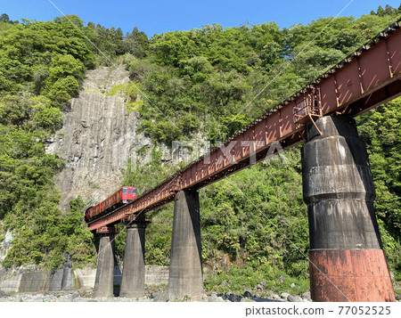 Iwato scenery Hyakueda iron bridge and red train Iwato scenery Hyakueda iron bridge and red train 77052525