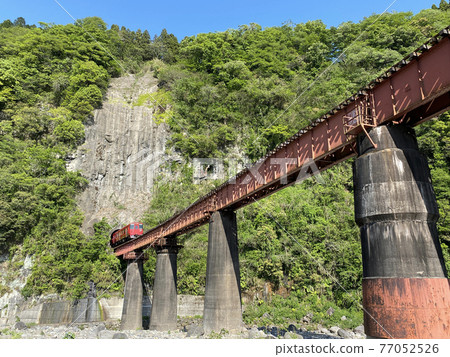 Iwato scenery Hyakueda iron bridge and red train Iwato scenery Hyakueda iron bridge and red train 77052526