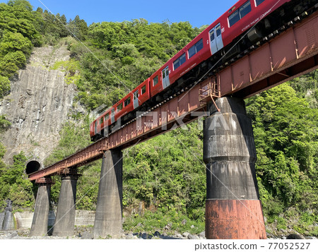 Iwato scenery Hyakueda iron bridge and red train Iwato scenery Hyakueda iron bridge and red train 77052527