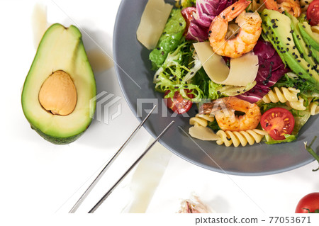 Healthy and appetizing pasta with shrimps and herbs. Healthy and appetizing pasta with shrimps and herbs. 77053671