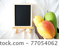 Several types of mango and blackboard 77054062