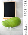 Green mango and blackboard 77054068