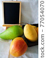 Several types of mango and blackboard 77054070