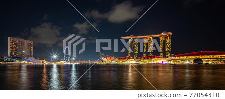 Panorama scene of Marina Bay Sands hotel at night Panorama scene of Marina Bay Sands hotel at night 77054310