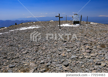 Scenery of the summit of Mt. Iodake, Yatsugatake mountain range with residual snow, Hokuto City, Yamanashi Prefecture, Japan Scenery of the summit of Mt. Iodake, Yatsugatake mountain range with residual snow, Hokuto City, Yamanashi Prefecture, Japan 77054463