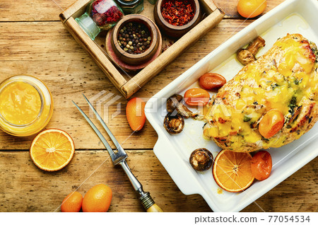 Turkey roll with kumquat and orange,wooden table Turkey roll with kumquat and orange,wooden table 77054534