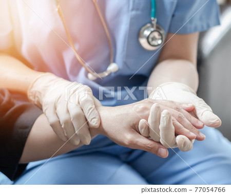 Surgeon, surgical doctor, anesthetist or anesthesiologist holding patient's hand for health care trust and support in professional ER surgical operation, medical anesthetic safety, healthcare concept Surgeon, surgical doctor, anesthetist or anesthesiologist holding patient's hand for health care trust and support in professional ER surgical operation, medical anesthetic safety, healthcare concept 77054766