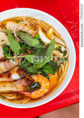 Vertical photo of delicious Vietnamese fish stock noodle soup, Bun Mam 77055537