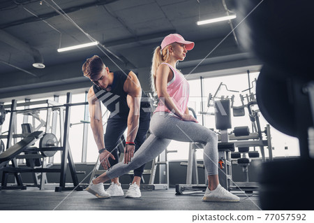 Side view of focused and motivated sporty young girl in sportswe Side view of focused and motivated sporty young girl in sportswe 77057592