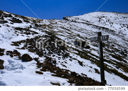 Road to the summit of Mt. Iodake, Yatsugatake mountain range with residual snow, Hokuto City, Yamanashi Prefecture, Japan Road to the summit of Mt. Iodake, Yatsugatake mountain range with residual snow, Hokuto City, Yamanashi Prefecture, Japan 77058599
