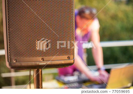 Dj mixing music outdoor. Dj mixing music outdoor. 77059695