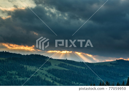 Storm clouds over mountains and the forest Storm clouds over mountains and the forest 77059950