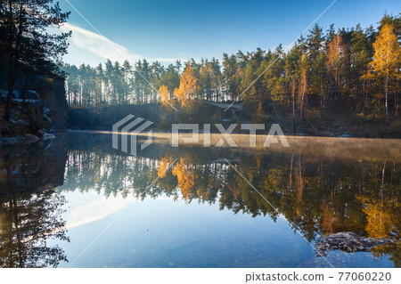 Fragment of the lake in the autumn forest 77060220