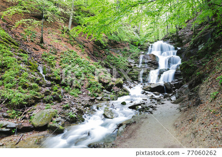 small waterfall of mountain river small waterfall of mountain river 77060262