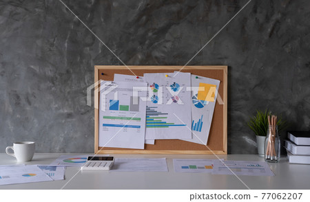 Business Workspace at home with laptop computer, financial document and office supplies on office workplace 77062207