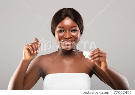 Tooth Care Concept. Portrait Of Beautiful Black Female Using Dental Floss Tooth Care Concept. Portrait Of Beautiful Black Female Using Dental Floss 77062495