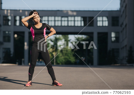 Jogging for beginner, hard training and respite, sport outdoor, urban fitness and workout on street 77062593