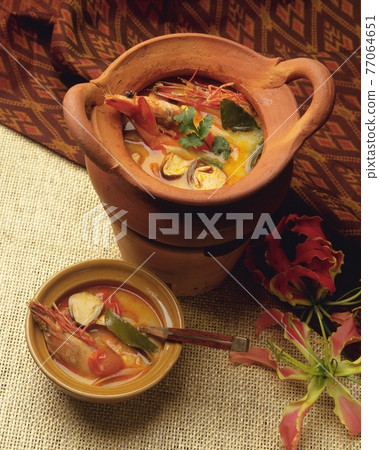delicious thai soup with seafood 77064651