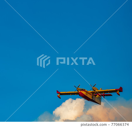 Fire hydroplane over the clouds with clear sky Fire hydroplane over the clouds with clear sky 77066374