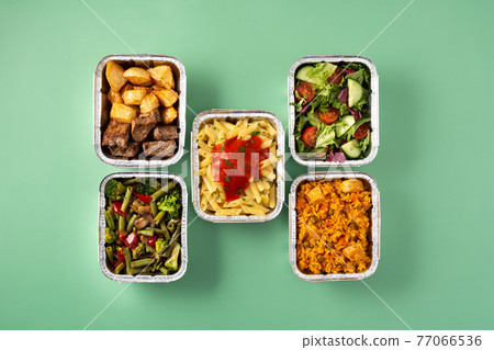 Take away healthy food in foil boxes Take away healthy food in foil boxes 77066536