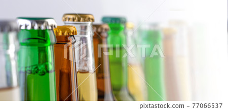 colorful beer bottle necks close-up, 77066537