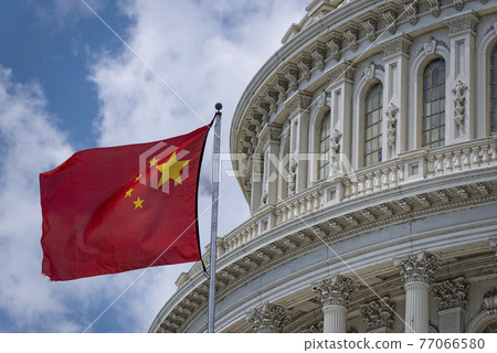China flag waving on Washington DC Capitol dome detail with waving chinese flag China flag waving on Washington DC Capitol dome detail with waving chinese flag 77066580