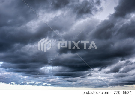 Dark dramatic sky and stormy clouds Dark dramatic sky and stormy clouds 77066624
