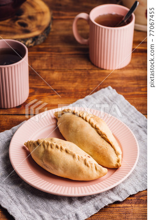 Two Cabbage Mini Pies on Plate 77067455