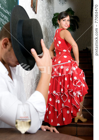 Flamenco dancers from Seville in Spain ready to dance in a typical Spanish venue 77068470