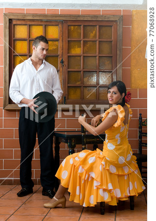 Flamenco dancers from Seville in Spain prepared to dance in a typical Spanish venue 77068928