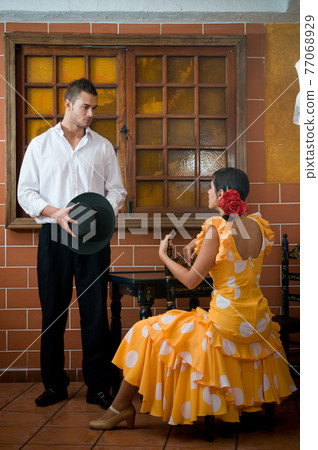 Flamenco dancers from Seville in Spain prepared to dance in a typical Spanish venue Flamenco dancers from Seville in Spain prepared to dance in a typical Spanish venue 77068929