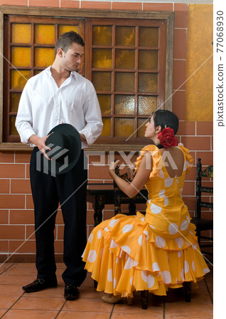 Flamenco dancers from Seville in Spain prepared to dance in a typical Spanish venue 77068930
