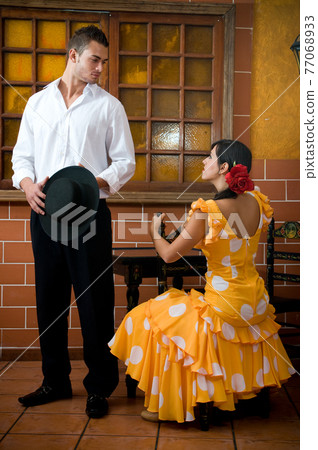 Flamenco dancers from Seville in Spain prepared to dance in a typical Spanish venue Flamenco dancers from Seville in Spain prepared to dance in a typical Spanish venue 77068933