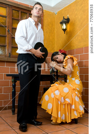 Flamenco dancers from Seville in Spain prepared to dance in a typical Spanish venue Flamenco dancers from Seville in Spain prepared to dance in a typical Spanish venue 77068938