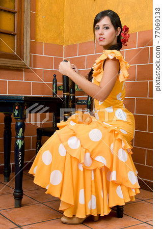 Flamenco dancer from Seville in Spain dancing in a typical Spanish venue 77069138
