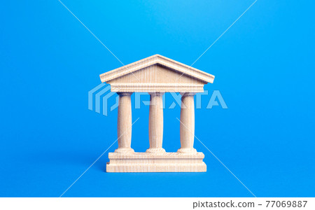 Building figurine with pillars in antique style. Concept of city administration, bank, university, court or library. Banking, education, government. Architectural monument in the old part of the city. Building figurine with pillars in antique style. Concept of city administration, bank, university, court or library. Banking, education, government. Architectural monument in the old part of the city. 77069887