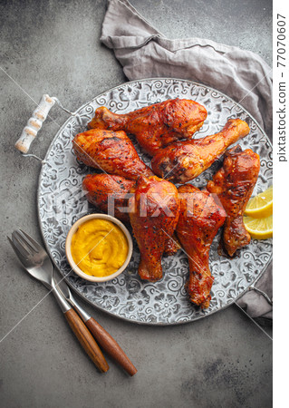 Indian food Tandoori chicken legs from above Indian food Tandoori chicken legs from above 77070607