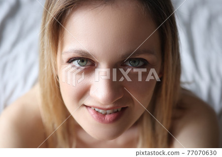 Portrait of young beautiful woman with green eyes Portrait of young beautiful woman with green eyes 77070630