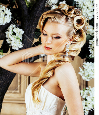 beauty emotional blond bride in luxury interior dreaming, crazy complicate hairstyle, many flowers beauty emotional blond bride in luxury interior dreaming, crazy complicate hairstyle, many flowers 77072976